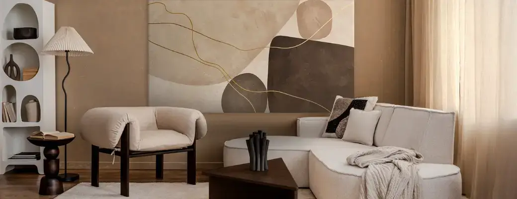 A Modern Living Room in Earthy Tones with a Large Abstract Painting This modern living room is decorated in warm beige and brown tones. On the wall is an abstract painting depicting rounded, organic shapes in shades of coffee with milk and dark chocolate, intersected by golden, wavy lines.
